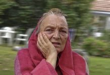 Old woman distraught after being asked to stop licking envelopes